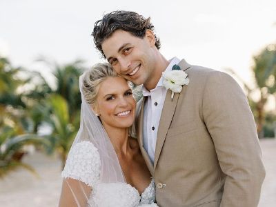 Madison LeCroy and Brett Randle are on their wedding dress posing for the photograph.